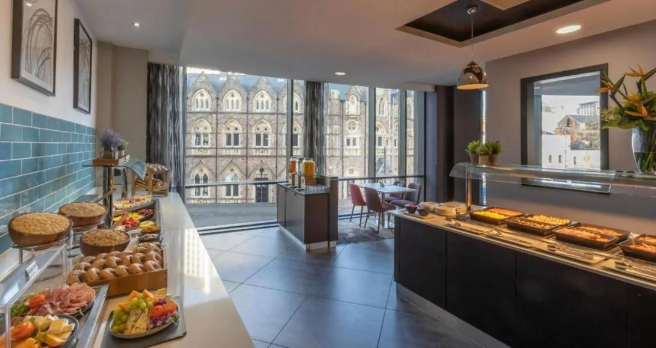 a buffet in a hotel with a lot of food at Clayton Hotel Cardiff in Cardiff