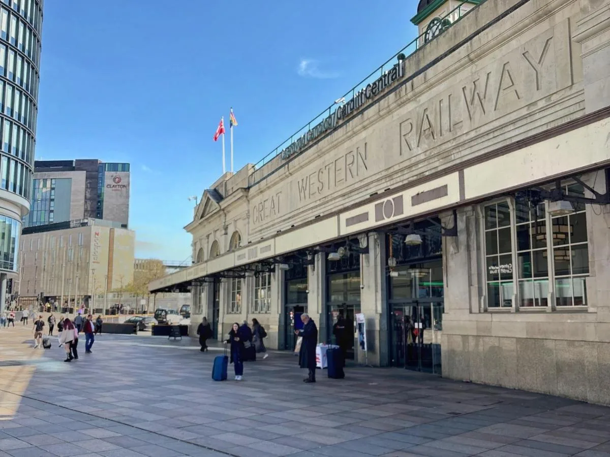 a building with people walking in front of it at Clayton Hotel Cardiff in Cardiff